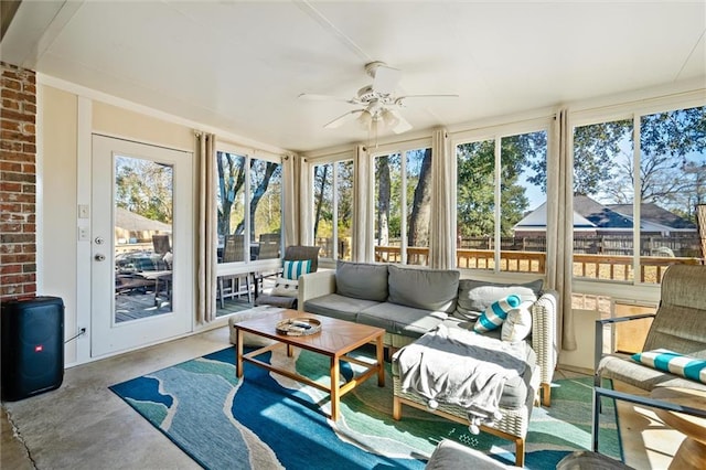 sunroom / solarium with ceiling fan