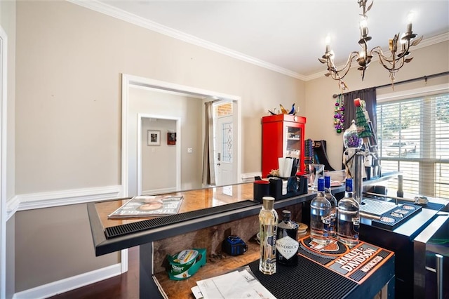 office area with dark hardwood / wood-style floors, a notable chandelier, and ornamental molding