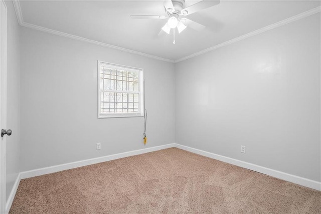 empty room with crown molding, carpet flooring, and ceiling fan