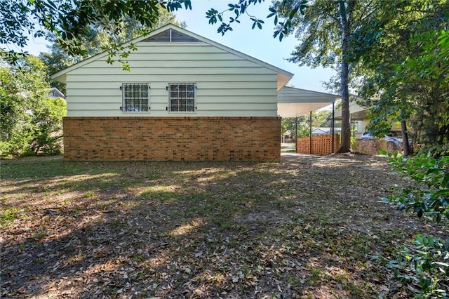 view of home's exterior featuring a carport