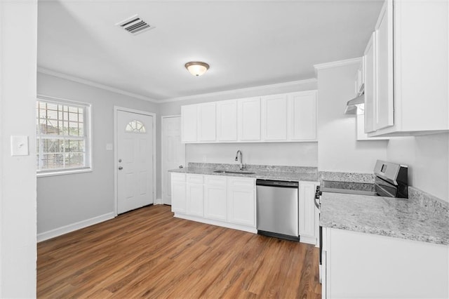 kitchen featuring wood-type flooring, dishwasher, sink, white cabinetry, and ornamental molding