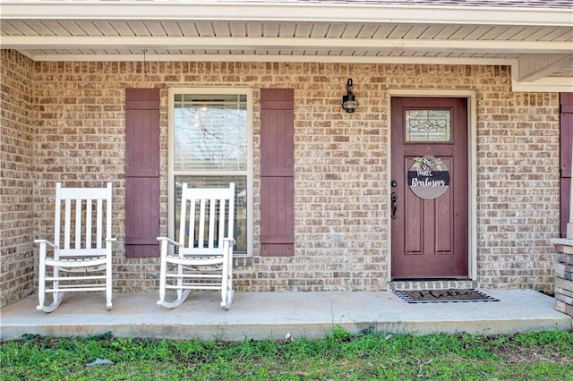 entrance to property featuring a porch