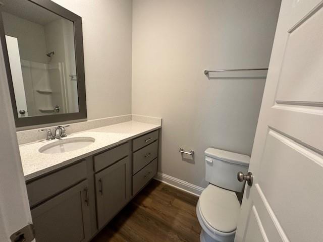 kitchen with crown molding, light stone counters, sink, appliances with stainless steel finishes, and white cabinets