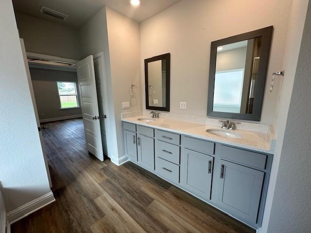 bathroom featuring vanity and hardwood / wood-style floors