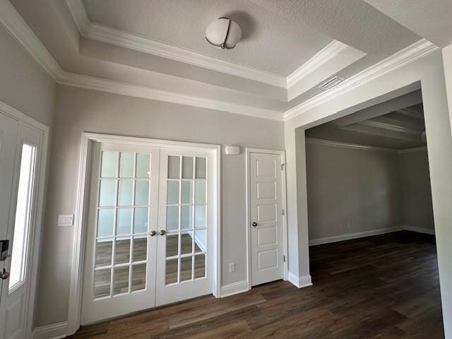 empty room featuring hardwood / wood-style floors, a chandelier, and french doors