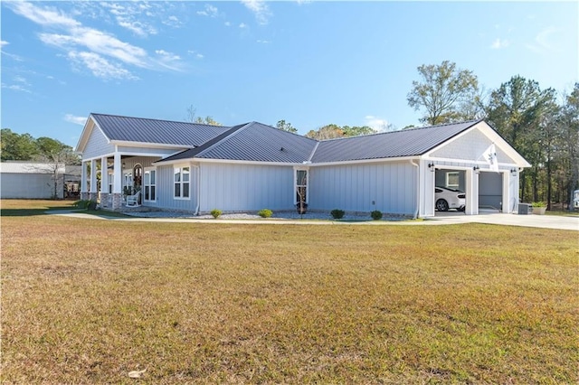 ranch-style house with a garage and a front lawn