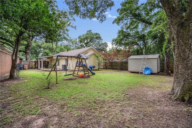 view of yard with a playground, a shed, and an outdoor structure
