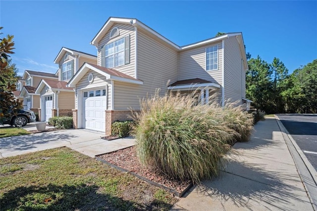 1517 Regency Rd Unit 46, Gulf Shores, AL 36542 - view of front facade featuring concrete driveway, a garage, and brick siding