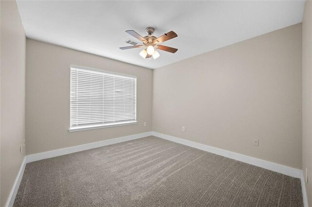 1517 Regency Rd Unit 46, Gulf Shores, AL 36542 - unfurnished room with carpet flooring, baseboards, and ceiling fan