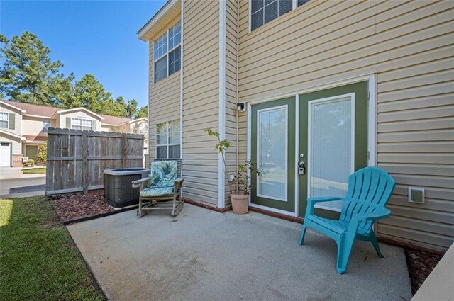 1517 Regency Rd Unit 46, Gulf Shores, AL 36542 - view of patio with central AC unit and fence