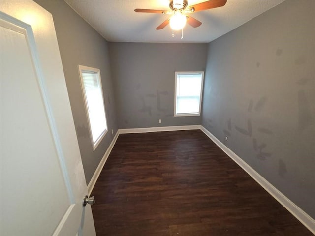 1105 Adams St, Mobile, AL 36603 - spare room featuring dark wood finished floors and a ceiling fan