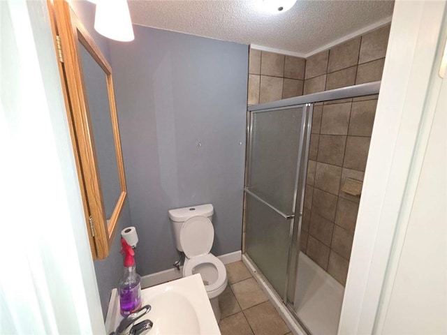 1105 Adams St, Mobile, AL 36603 - bathroom with a textured ceiling, a shower stall, and tile patterned floors
