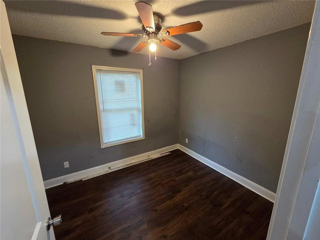 1105 Adams St, Mobile, AL 36603 - empty room with dark wood-style flooring, ceiling fan, and a textured ceiling