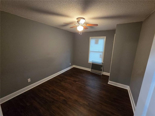 1105 Adams St, Mobile, AL 36603 - spare room featuring dark wood finished floors, ceiling fan, and a textured ceiling