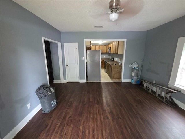 1105 Adams St, Mobile, AL 36603 - unfurnished living room with wood finished floors, ceiling fan, and a textured ceiling