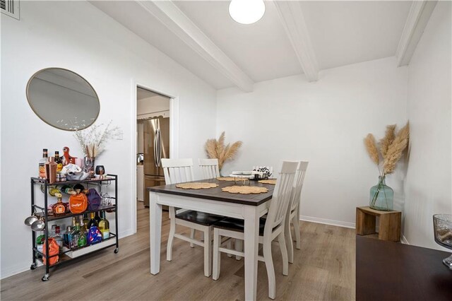 5554 Racine Ave, Mobile, AL 36618 - dining area with beam ceiling and light wood finished floors