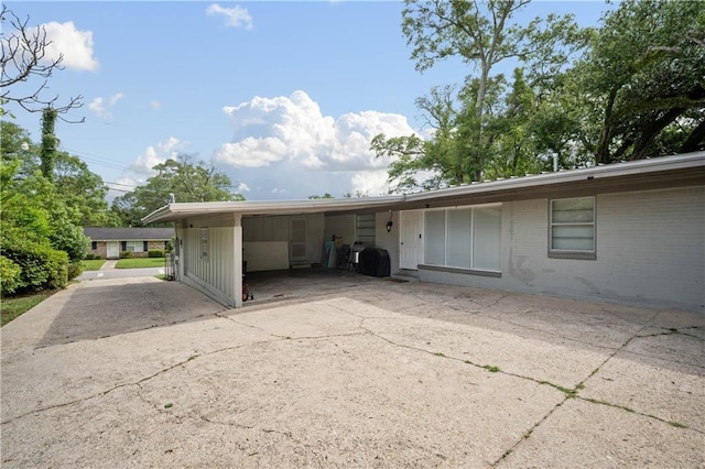 5554 Racine Ave, Mobile, AL 36618 - view of front of home with brick siding and a carport