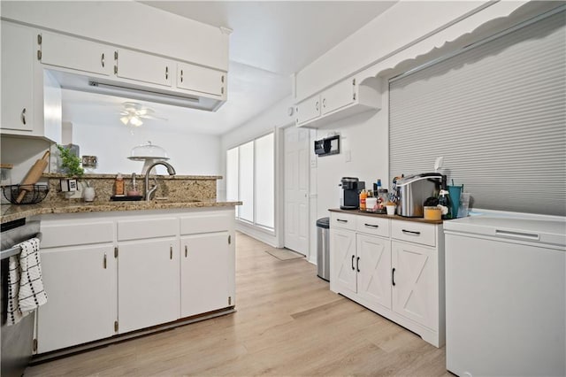 5554 Racine Ave, Mobile, AL 36618 - kitchen featuring refrigerator, a ceiling fan, light wood finished floors, and white cabinets