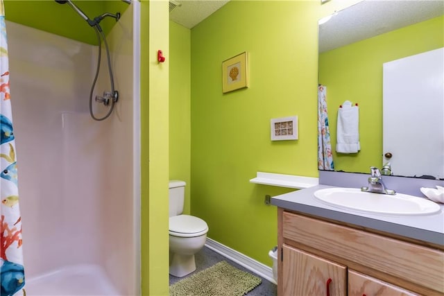 full bathroom with vanity, a shower with curtain, baseboards, a textured ceiling, and toilet