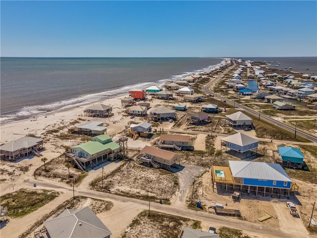 drone / aerial view featuring a view of the beach and a water view