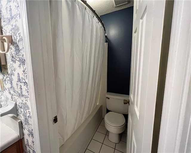 full bathroom with shower / bath combo, vanity, tile patterned flooring, toilet, and a textured ceiling