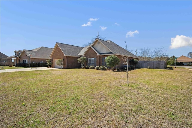 view of front facade featuring brick siding, an attached garage, concrete driveway, and a front lawn