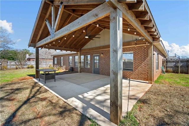 view of patio with fence private yard and ceiling fan