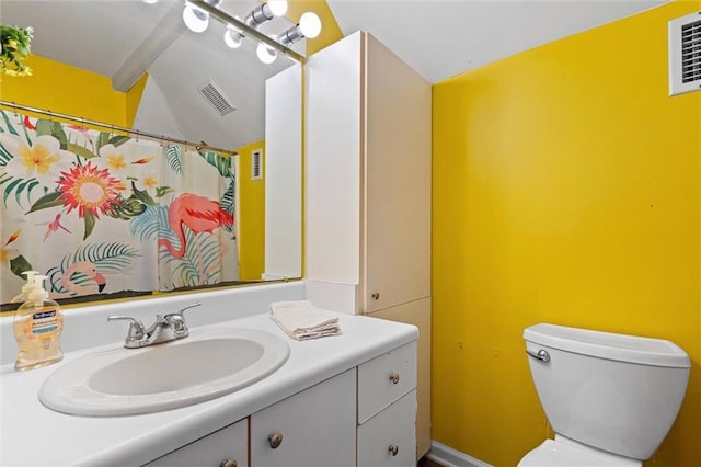 2344 Island Shores Dr, Dauphin Island, AL 36528 - full bath featuring vanity, toilet, lofted ceiling, and a shower with curtain