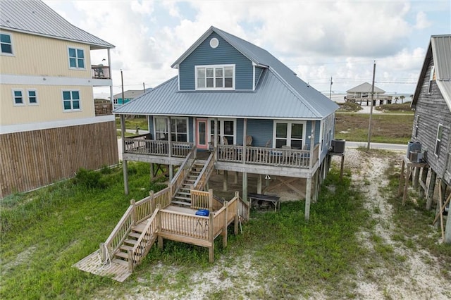 2344 Island Shores Dr, Dauphin Island, AL 36528 - rear view of property featuring stairway, central AC unit, and metal roof
