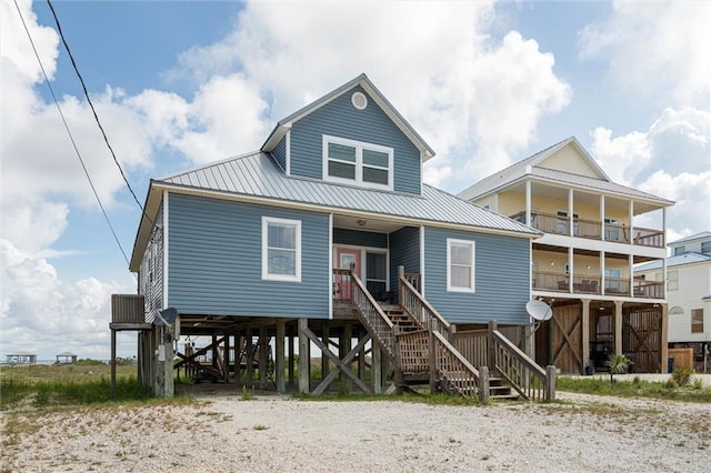 2344 Island Shores Dr, Dauphin Island, AL 36528 - back of house with stairs, covered porch, and metal roof