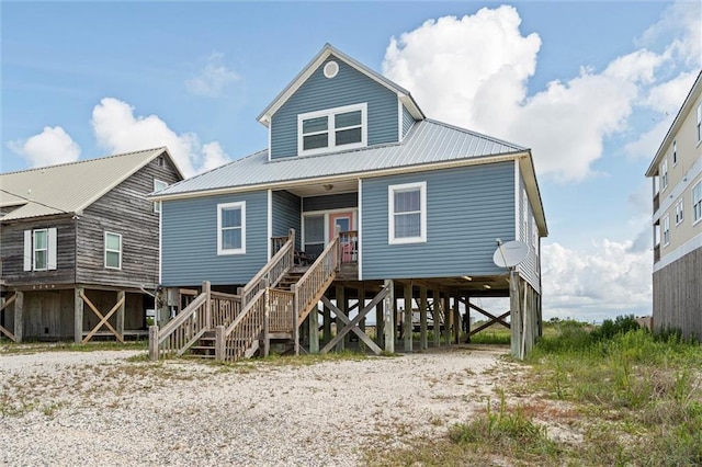2344 Island Shores Dr, Dauphin Island, AL 36528 - beach home with stairs, covered porch, a carport, and metal roof