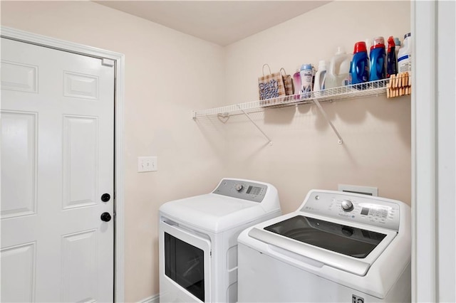 laundry room featuring laundry area and washing machine and clothes dryer