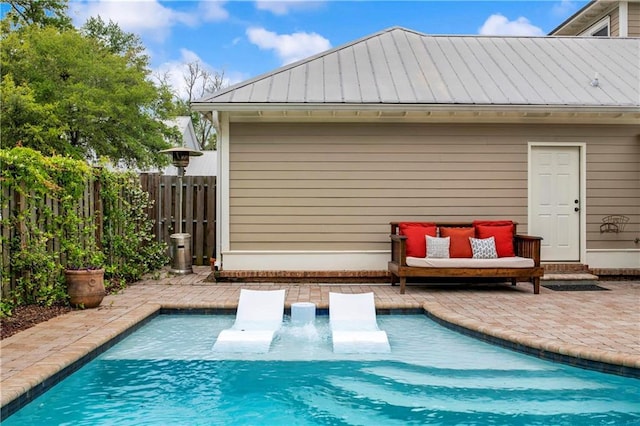 view of swimming pool featuring a patio area