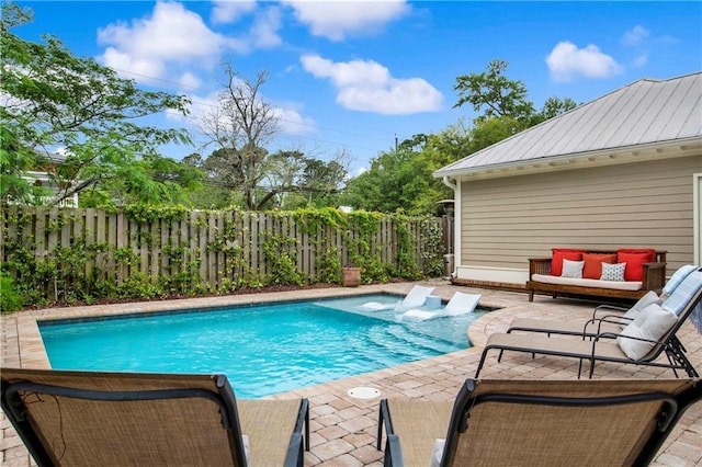 view of swimming pool featuring an outdoor hangout area and a patio area