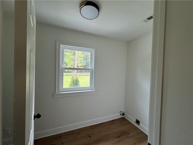 laundry room with hardwood / wood-style flooring