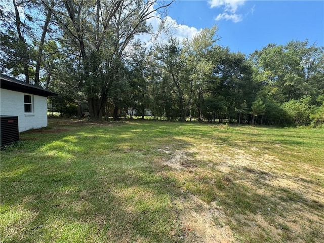 view of yard with central air condition unit