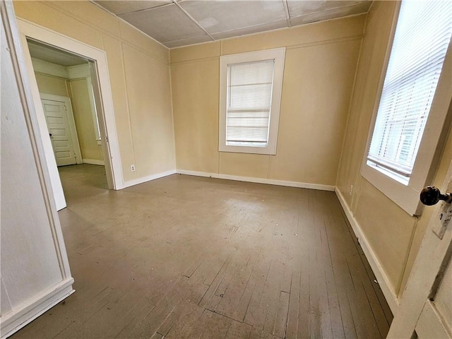 empty room with hardwood / wood-style flooring