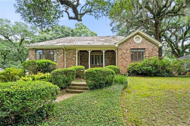 2007 Levert Dr N, Mobile, AL 36607 - ranch-style house featuring a front yard and brick siding