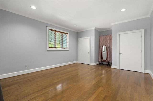 2007 Levert Dr N, Mobile, AL 36607 - spare room with wood finished floors, ornamental molding, baseboards, and recessed lighting