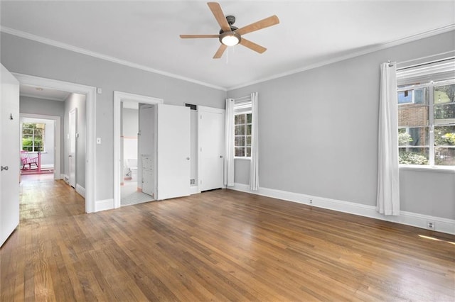 2007 Levert Dr N, Mobile, AL 36607 - unfurnished bedroom featuring wood finished floors, ornamental molding, baseboards, connected bathroom, and a ceiling fan