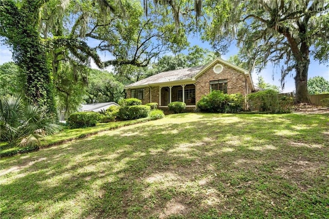 2007 Levert Dr N, Mobile, AL 36607 - ranch-style house featuring brick siding and a front lawn