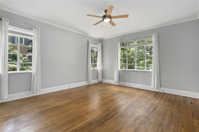2007 Levert Dr N, Mobile, AL 36607 - spare room featuring wood finished floors, plenty of natural light, a ceiling fan, baseboards, and crown molding