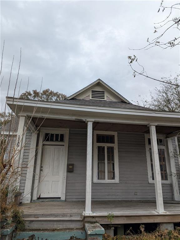 doorway to property with a porch