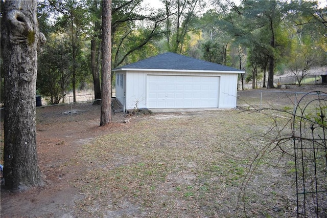 detached garage with fence