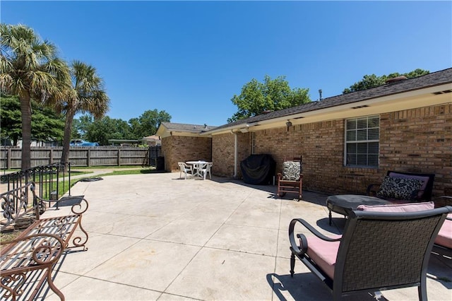 view of patio / terrace featuring fence