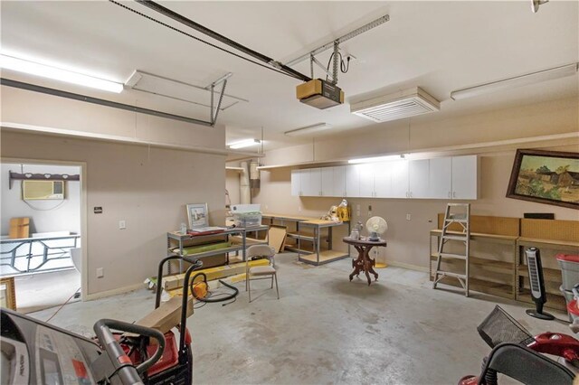 garage with a garage door opener and baseboards