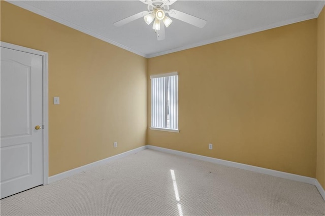 unfurnished room with light carpet, crown molding, and ceiling fan