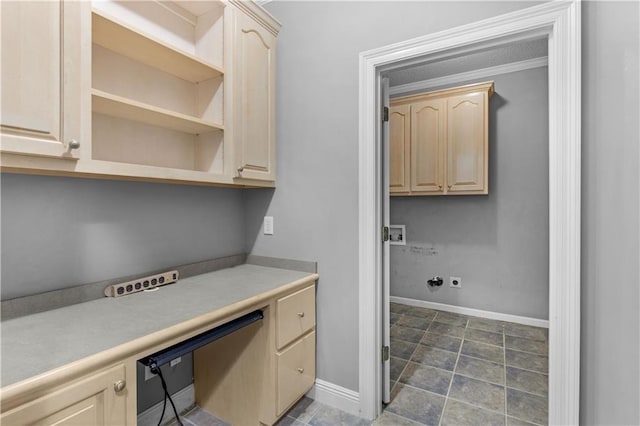 interior space with built in desk and light brown cabinetry