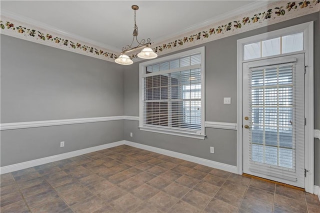 spare room featuring crown molding