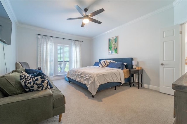 bedroom with ceiling fan, crown molding, light colored carpet, and baseboards